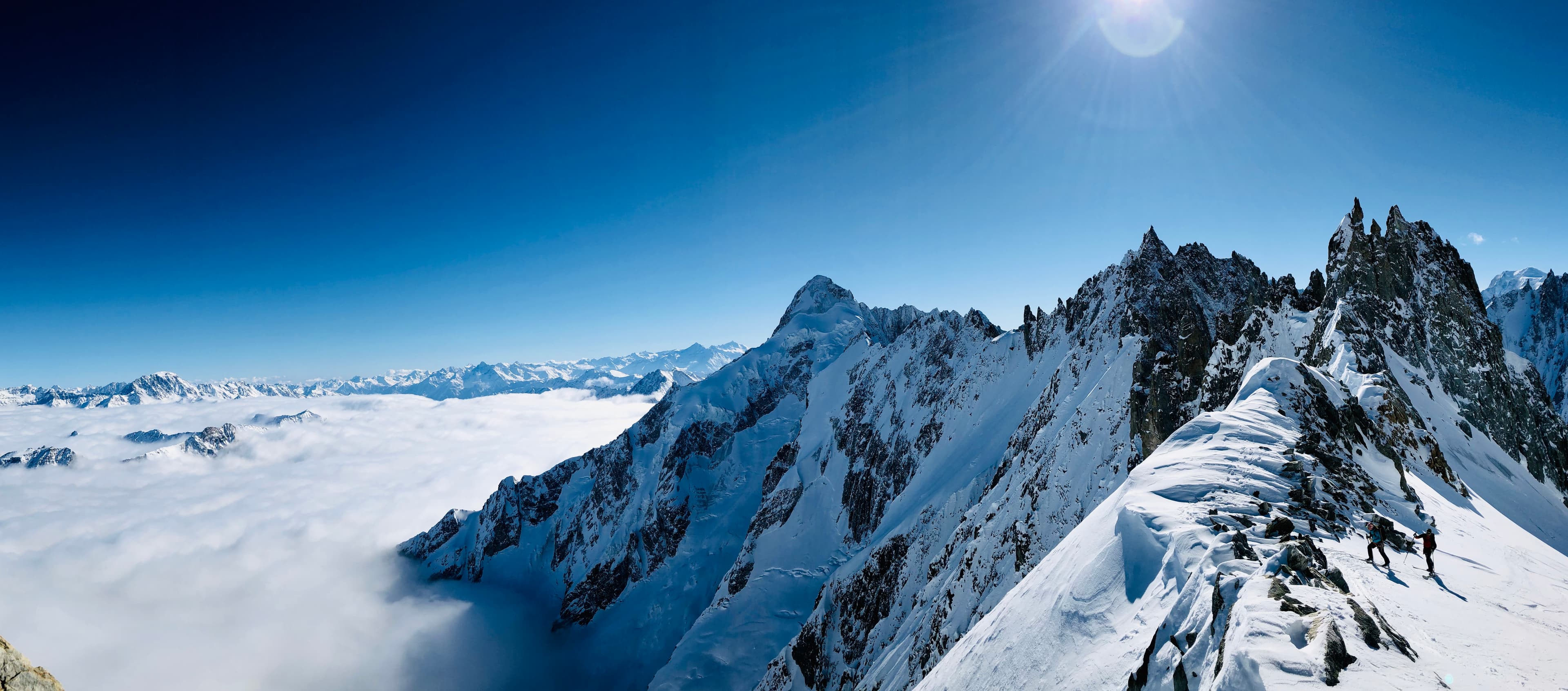Alpine ridge above the clouds